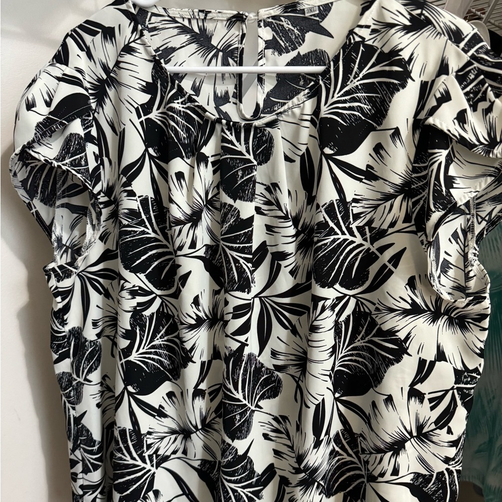 Black and white floral sleeveless shirt